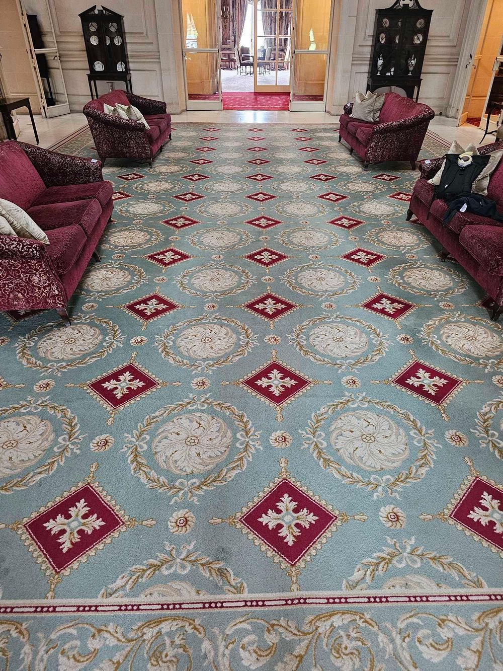 Lot 28: A Large Classical Revival Style Aqua Blue Fitted Carpet