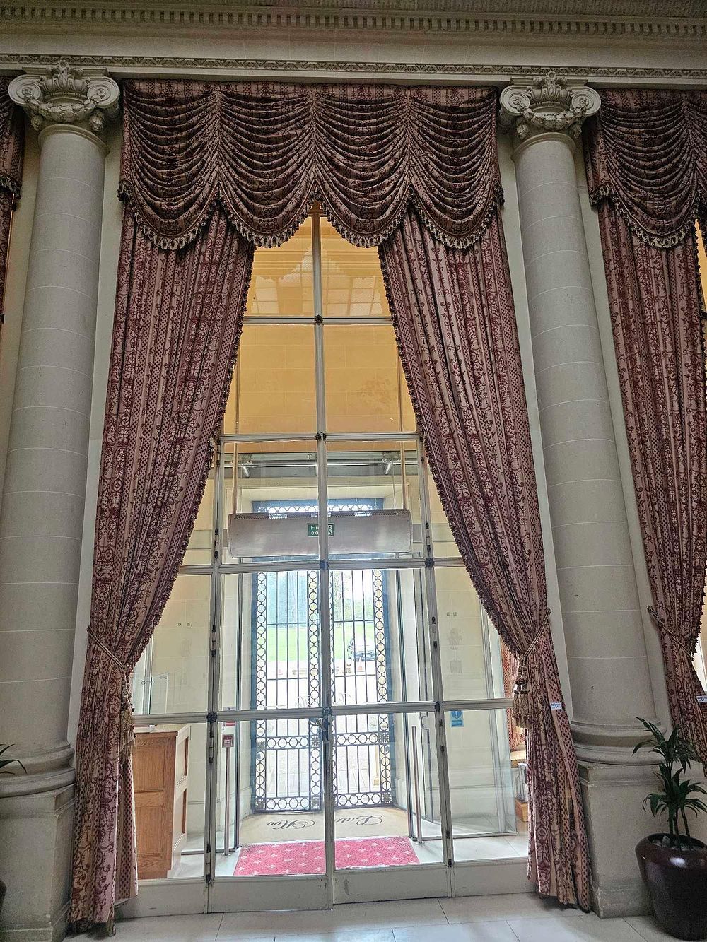 Lot 34: A Pair of Classical Revival Beige and Deep Red Damask Draperies with Swag Valance and Tie-Backs