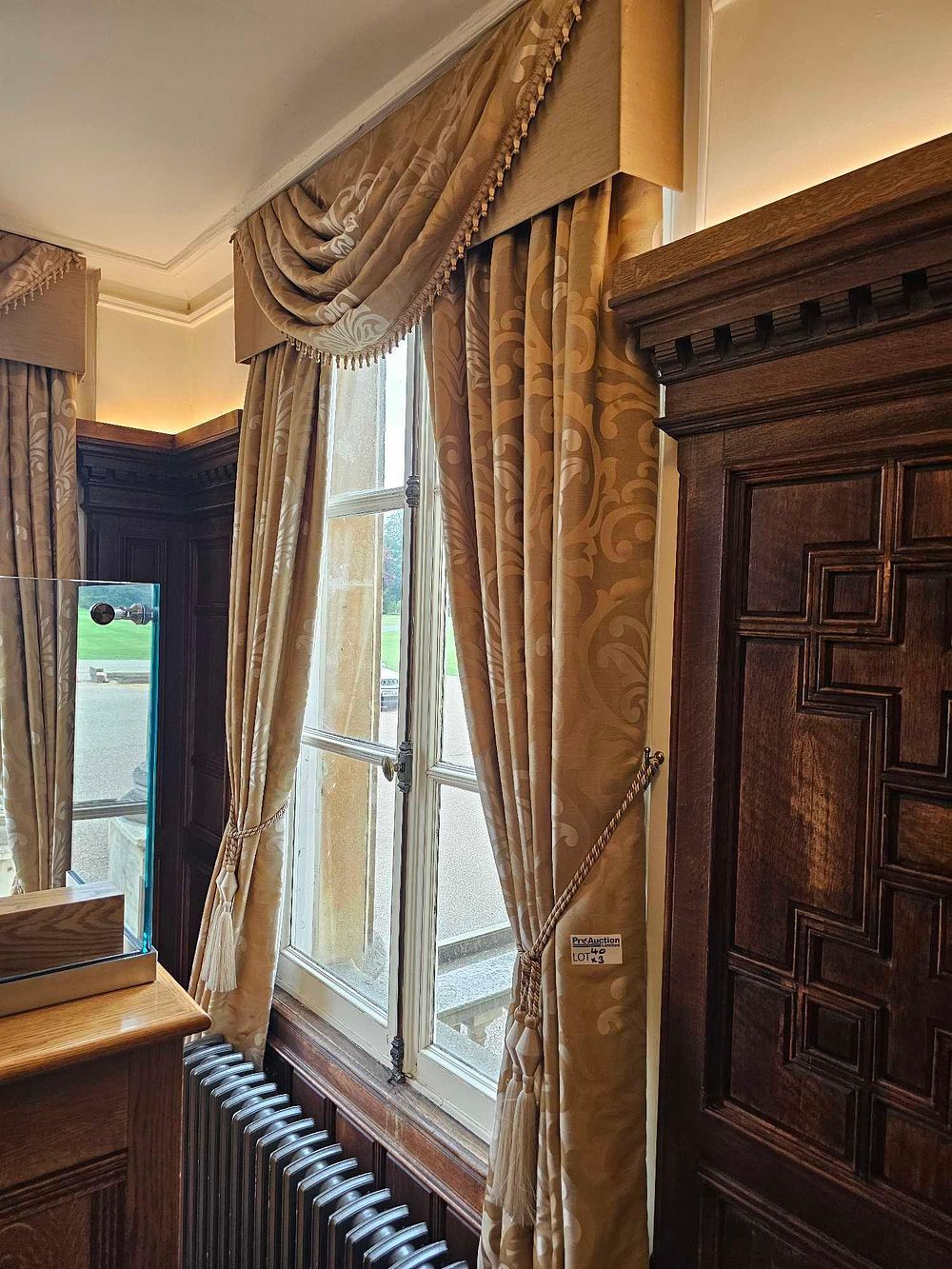 Lot 40: A Pair of Traditional Gold-Toned Brocade Draperies with Swagged Pelmet and Tie-Backs