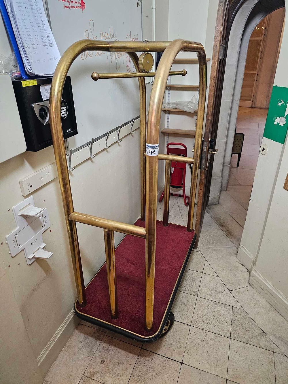 Lot 42: A Brass-Toned 'Birdcage Style' Hotel Bellhop Luggage Cart