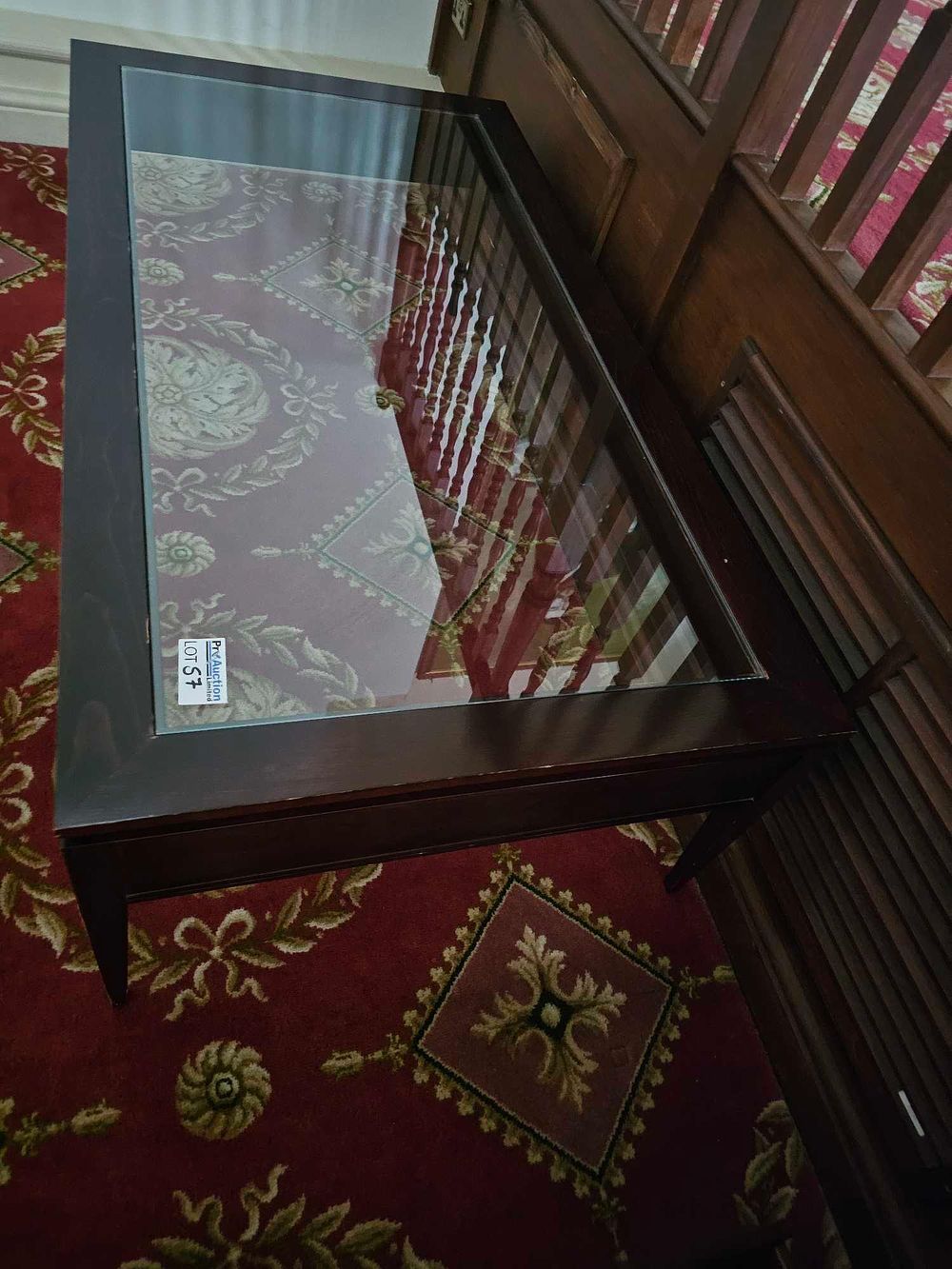 Lot 57: A Contemporary Dark-Stained Wood and Glass Coffee Table