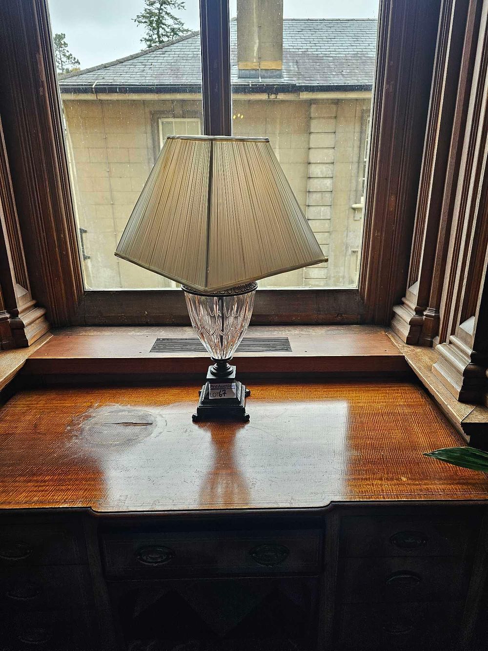 Lot 67: A Vintage Faceted Crystal and Patinated Metal Urn-Form Table Lamp, with Pleated Shade