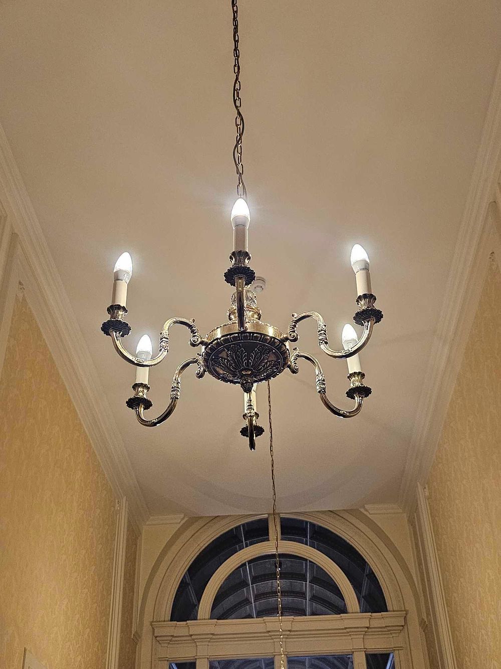 Lot 73: A Traditional Six-Light Brass-Toned Chandelier