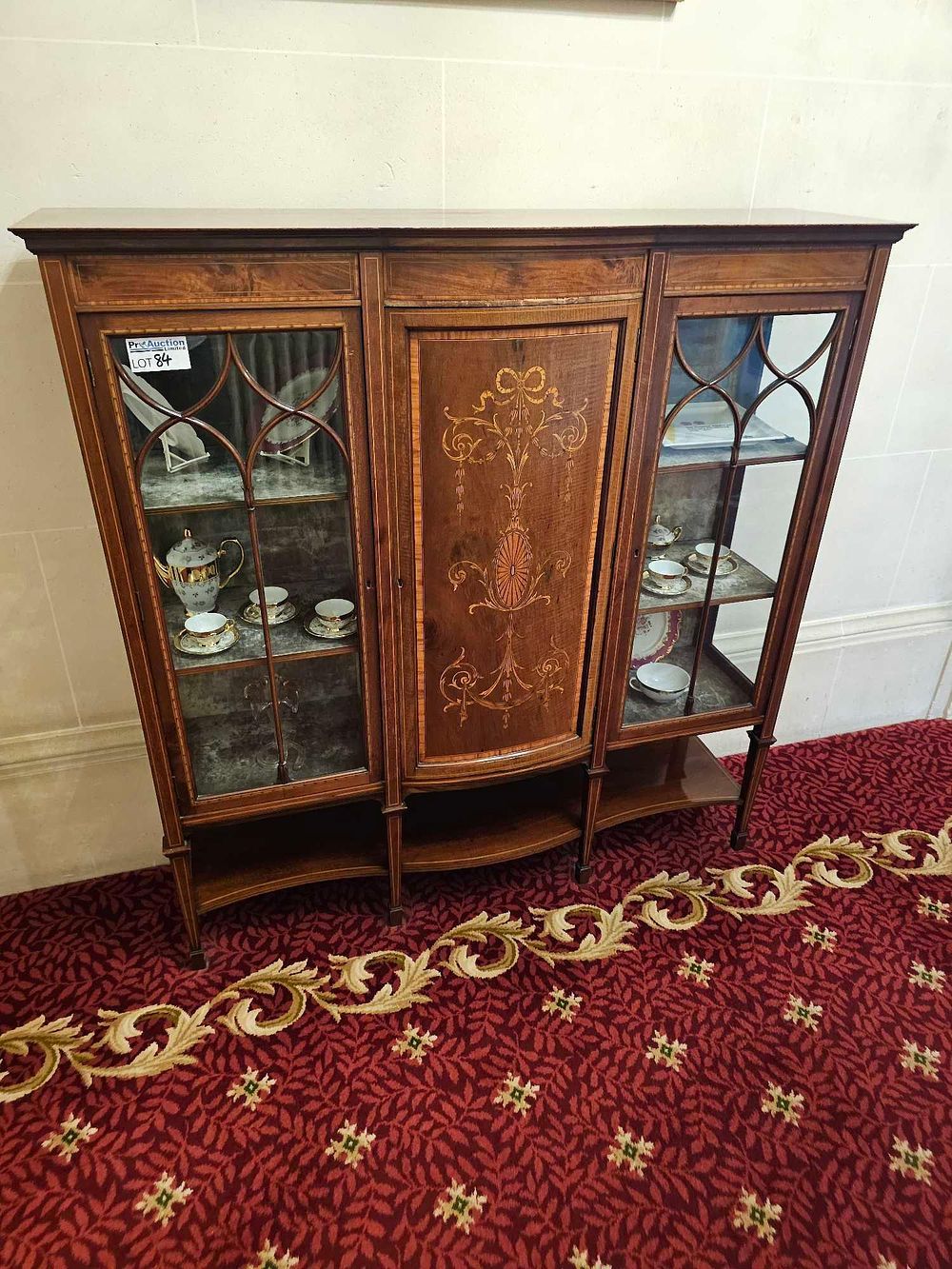 Lot 84: An Edwardian Inlaid Mahogany Triple-Section Display Cabinet