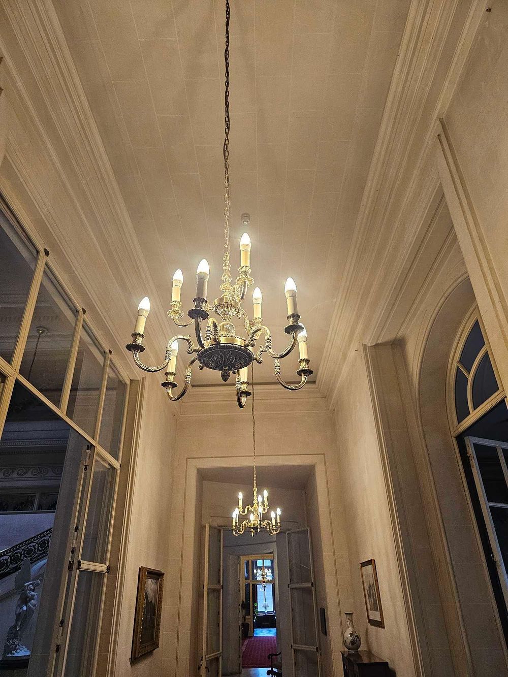 Lot 93: A French Louis XV Style Gilt and Patinated Metal Eight-Light Chandelier