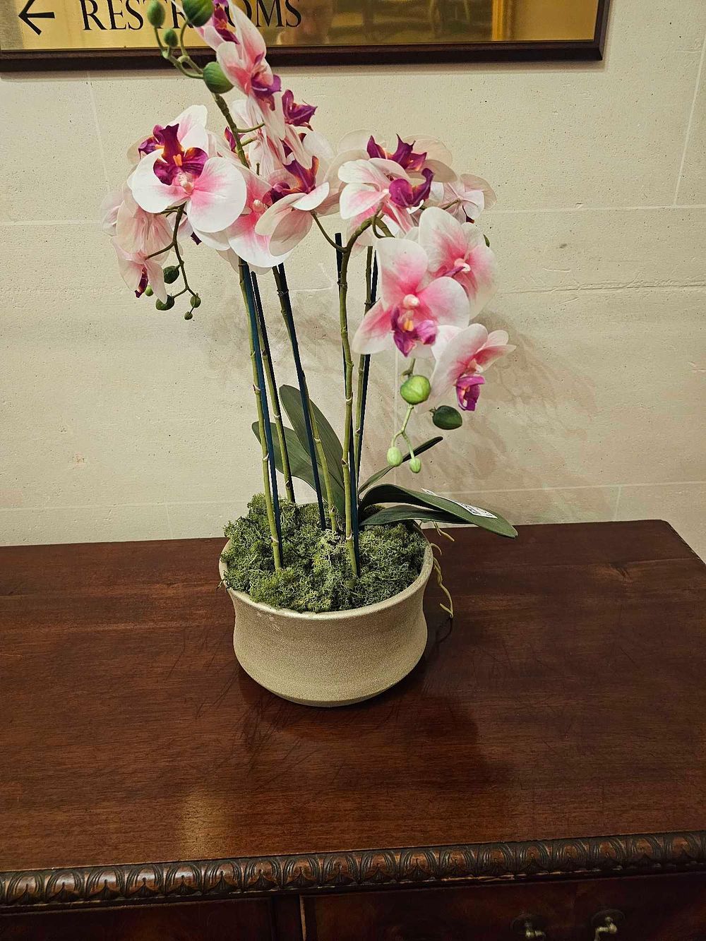 Lot 95: A Contemporary Faux Phalaenopsis Orchid Arrangement in a Textured Planter