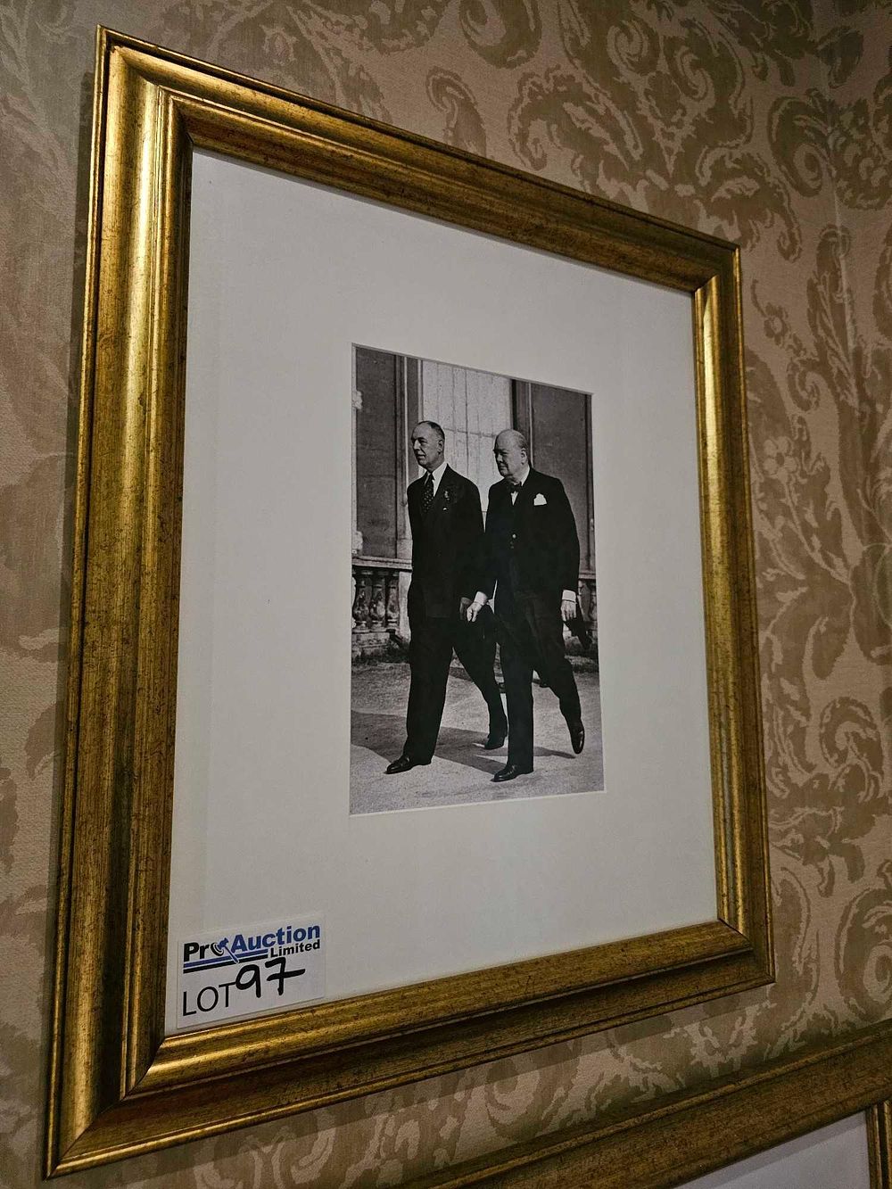 Lot 97: A Black and White Photograph of Winston Churchill and a Companion
