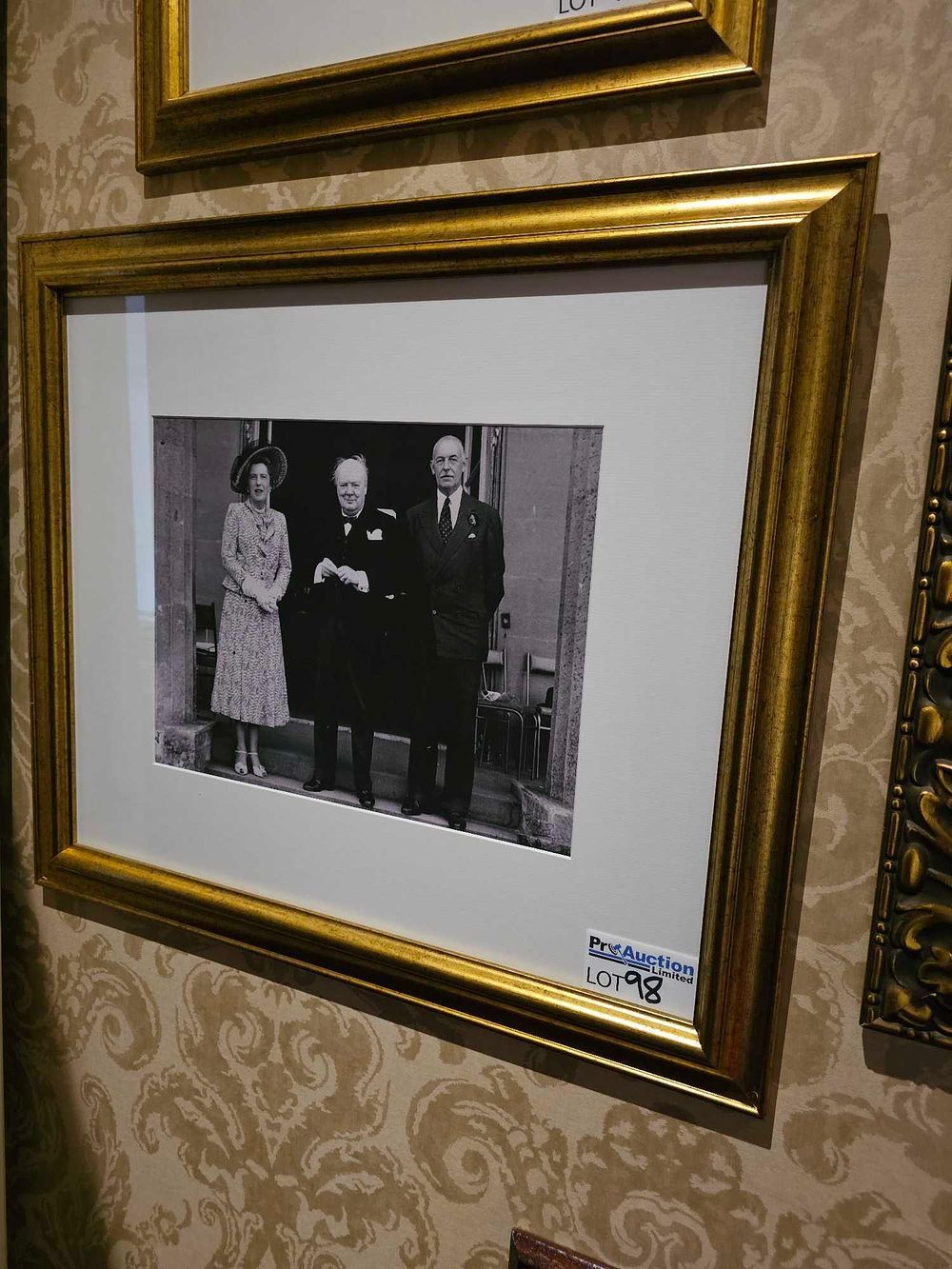 Lot 98: A Mid-20th Century Black and White Photograph of Three Figures, one resembling Winston Churchill