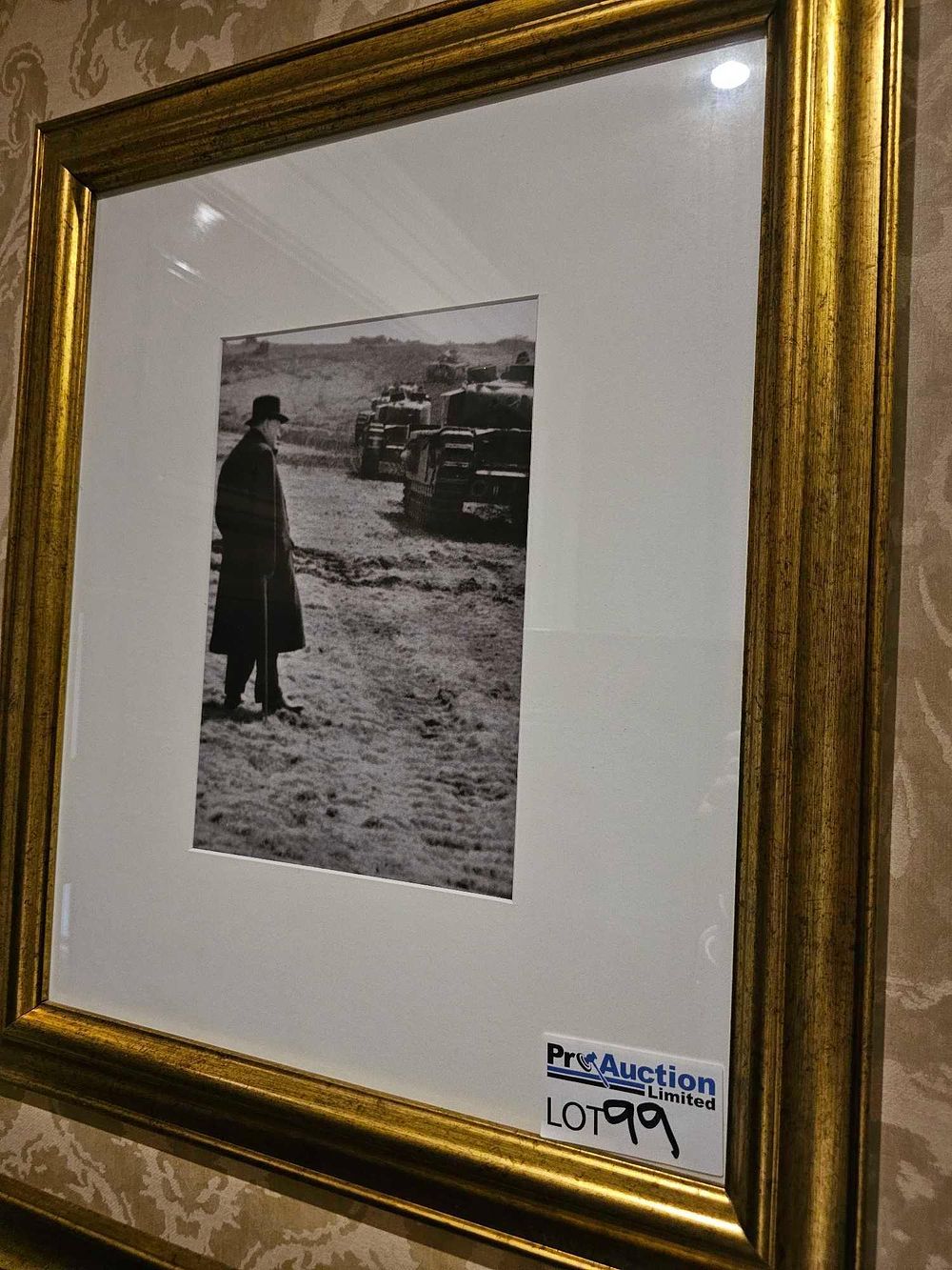 Lot 99: A Framed Black and White Photograph, Likely Winston Churchill with Military Tanks