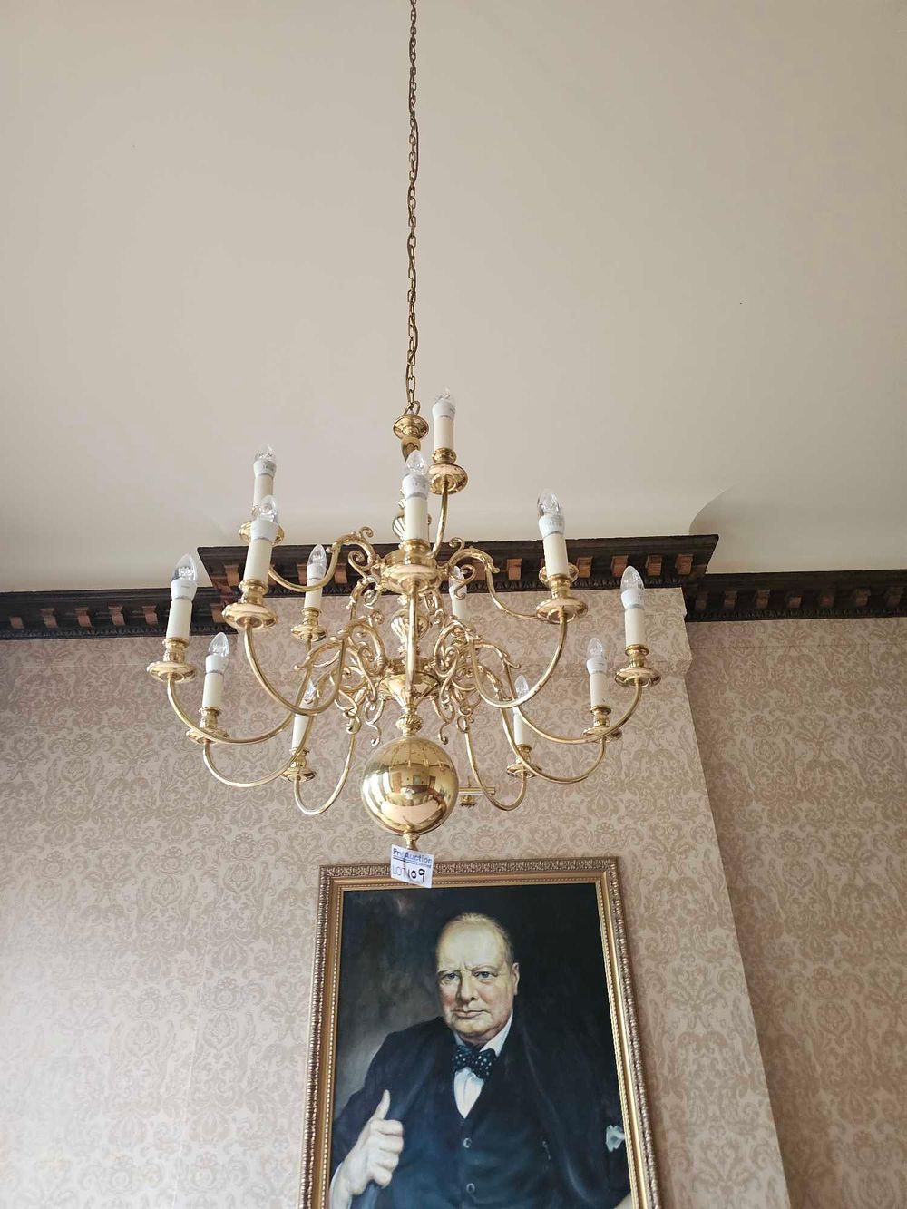 Lot 109: A Polished Brass Dutch Baroque 12-Light Chandelier