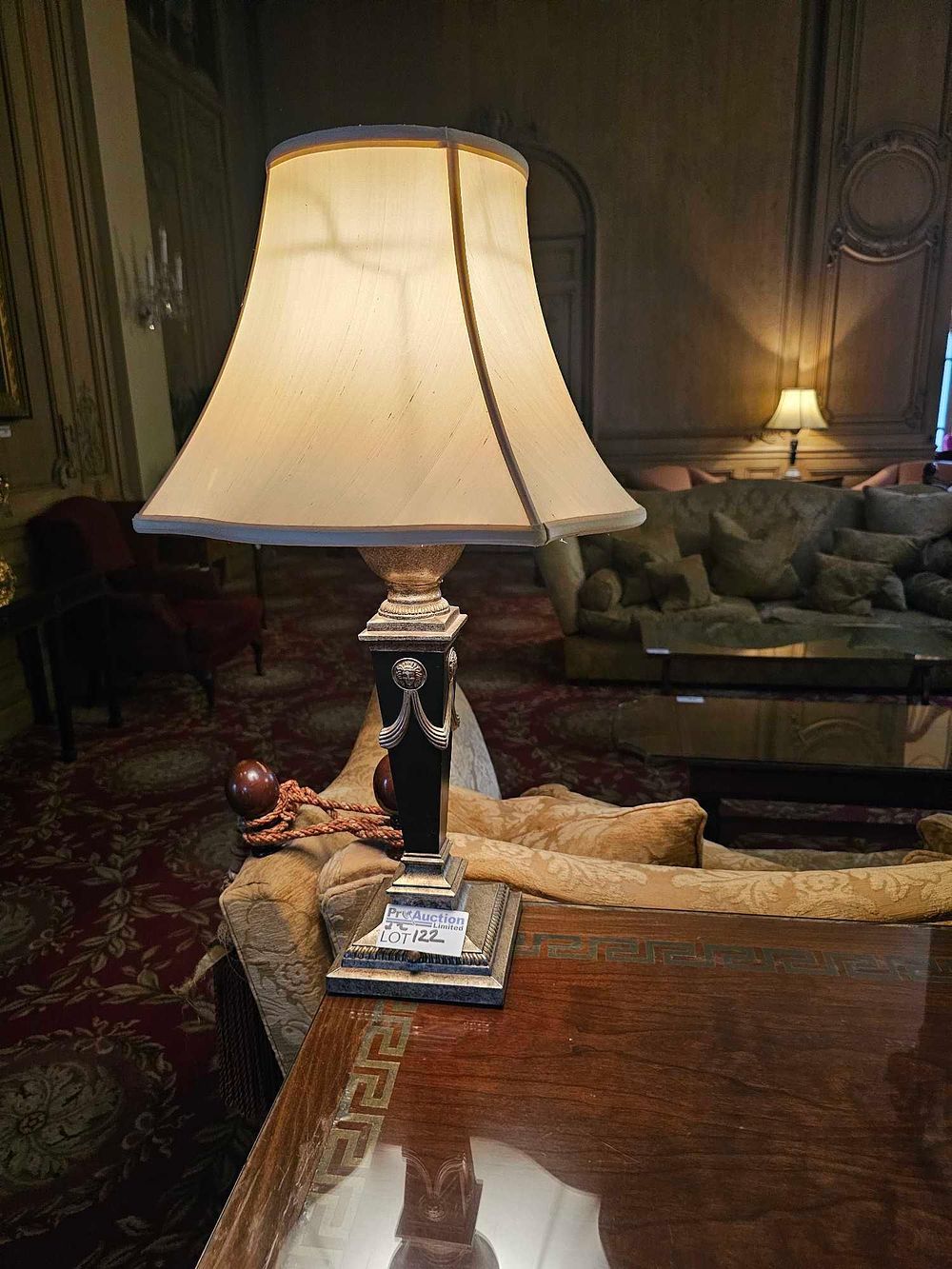 Lot 122: A Hollywood Regency Style Gilt Metal and Ebonized Table Lamp