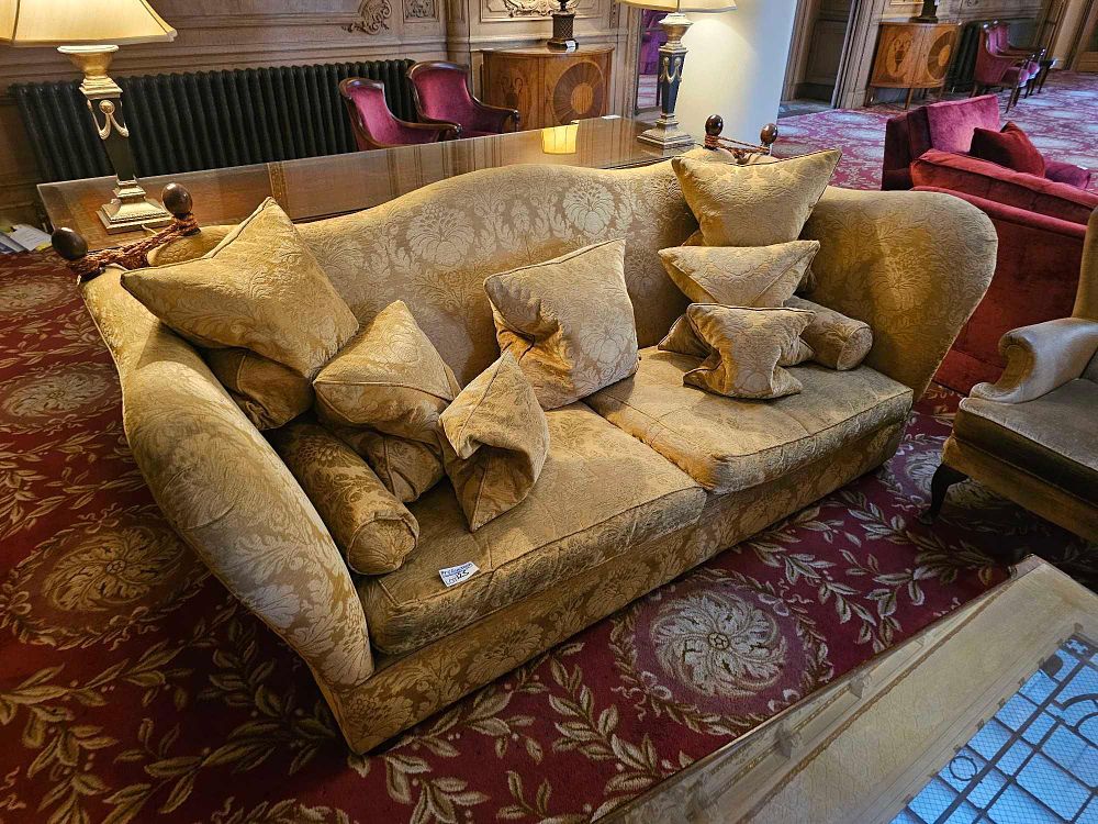 Lot 125: A Gold-Tone Damask Upholstered Two-Seater Sofa with Turned Finials