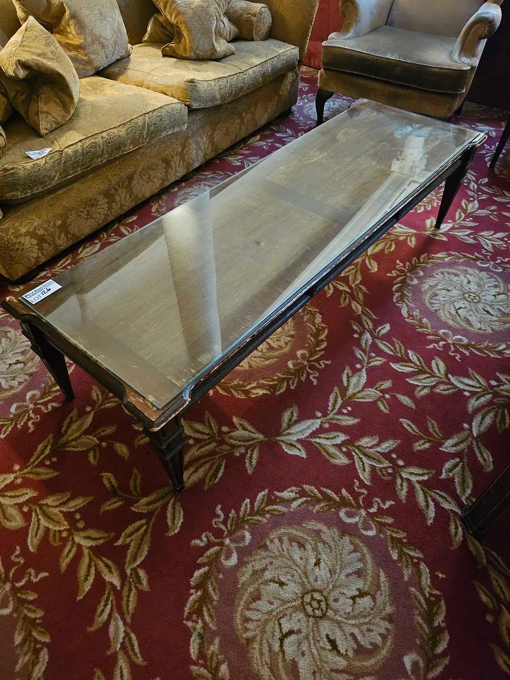 Lot 126: A Neoclassical Style Gilt-Accented Dark-Stained Wood and Glass Coffee Table