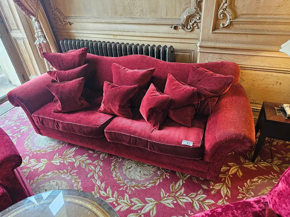 Lot 133: A Red Velvet Two-Seater Sofa with Scrolled Back and Rolled Arms
