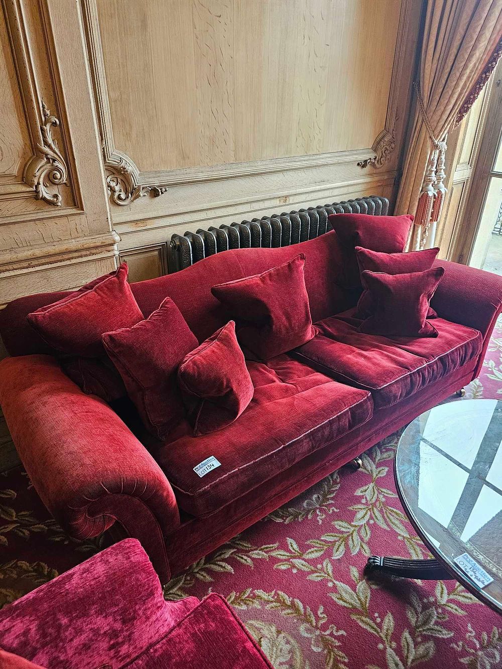 Lot 134: A Three-Seater Deep Red Velvet Sofa, Traditional Style