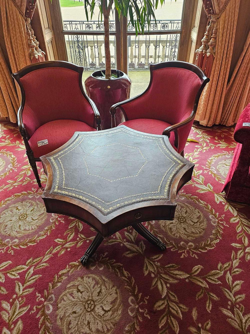 Lot 137: A Pair of Regency Style Mahogany Armchairs and an Octagonal Leather-Top Table