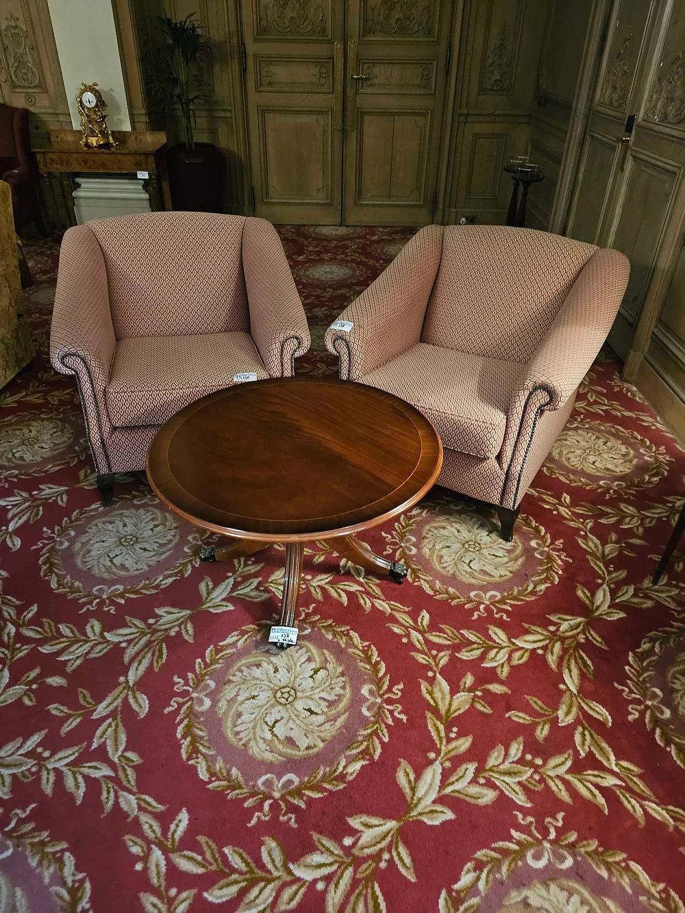 Lot 138: A Set of Two Mid-20th Century Club Armchairs and a Regency Revival Style Pedestal Table