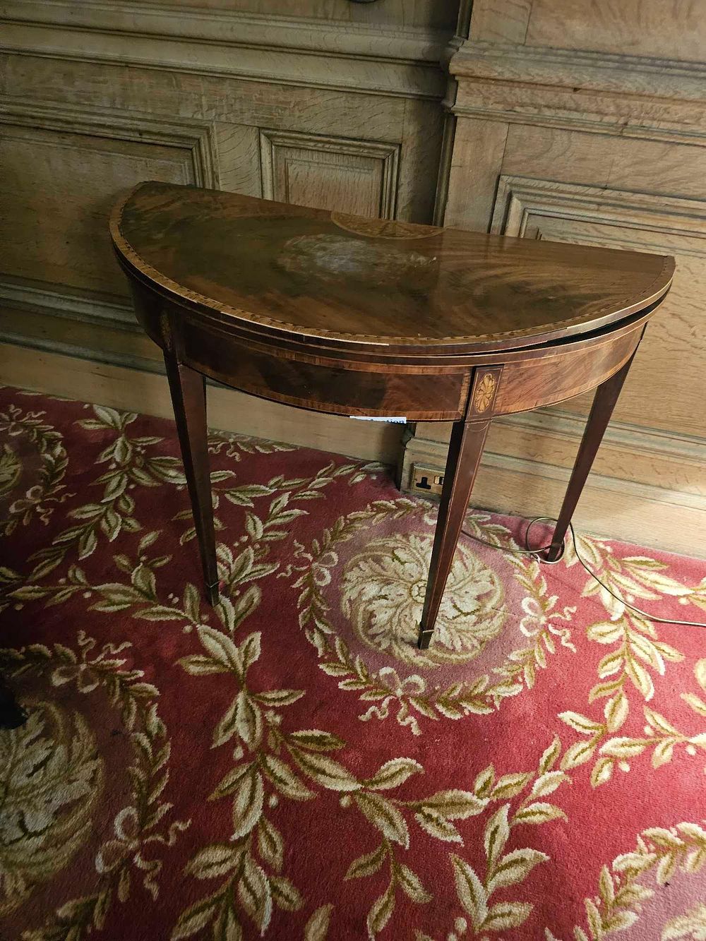 Lot 139: A Georgian Mahogany Inlaid Demi Lune Fold-Over Card Table