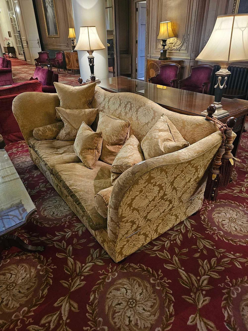 Lot 144: A Traditional Style Gold Damask Sofa