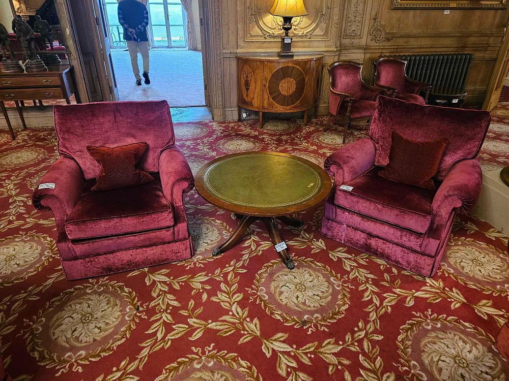 Lot 150: A Maitland Smith Mahogany Leather Top Round Occasional Table and A Pair of Upholstered Armchairs