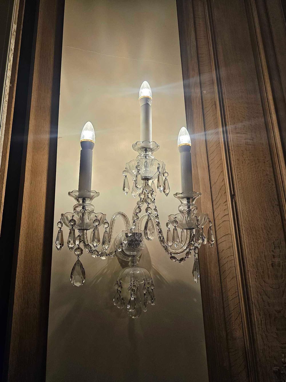 Lot 165: A Maria Theresa Style Three-Arm Crystal Wall Sconce