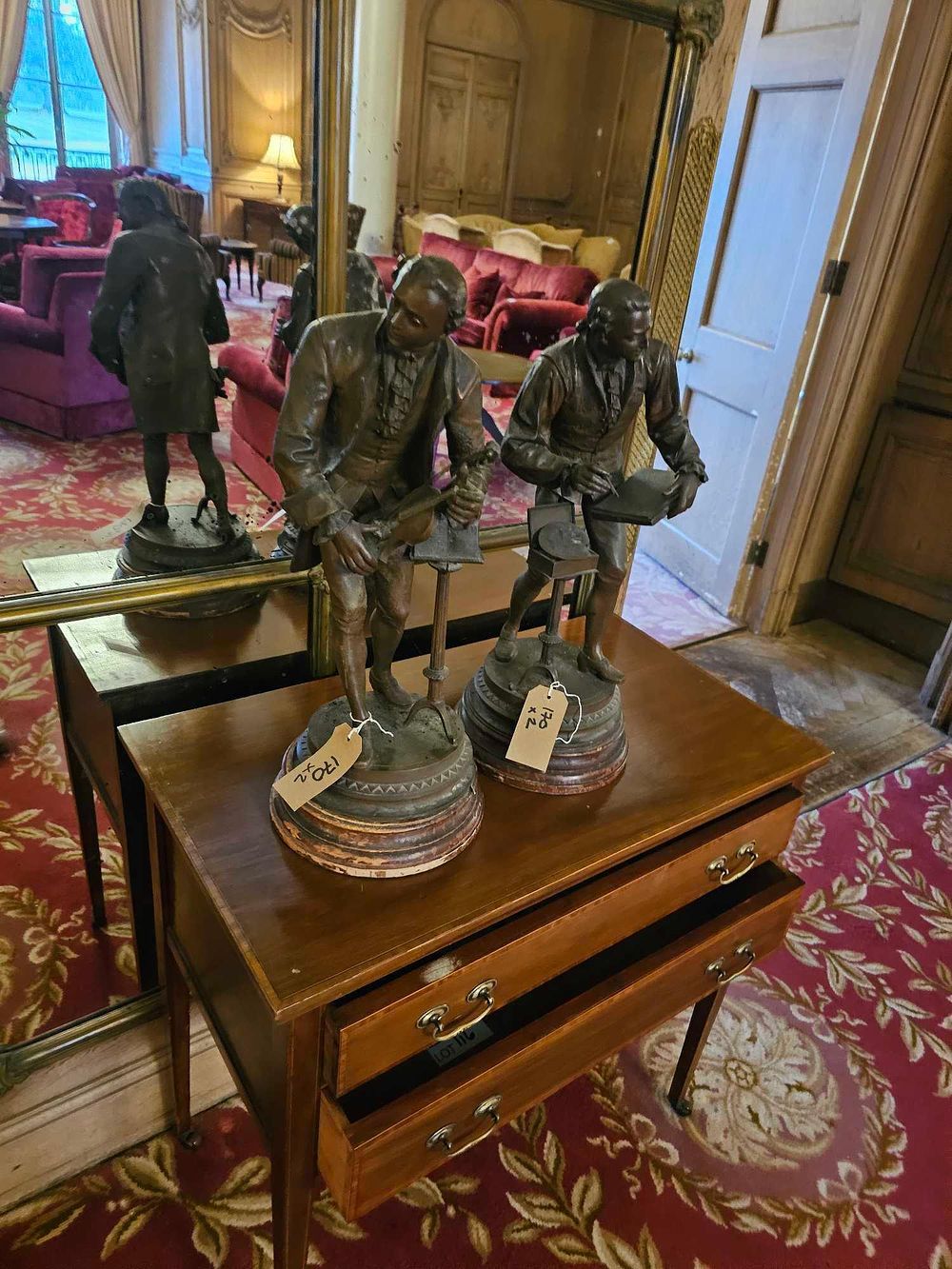Lot 170: A Pair of Patinated Cast Metal Figural Sculptures, depicting a Musician and an Artist