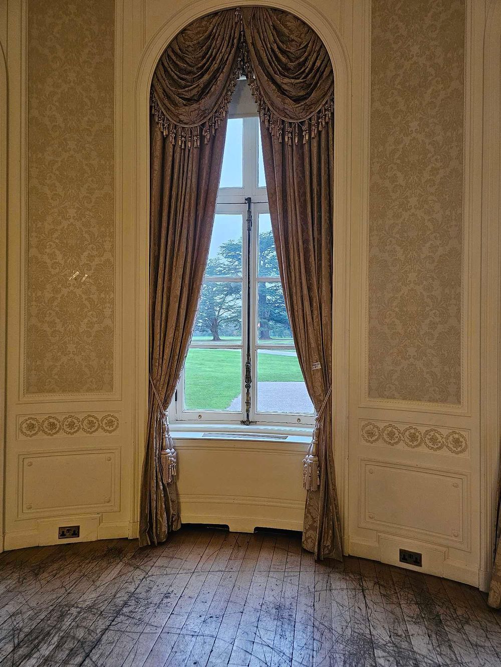Lot 187: A Pair of Gold-Taupe Damask or Jacquard Curtains with Pelmet and Tie-Backs, for an Arched Window