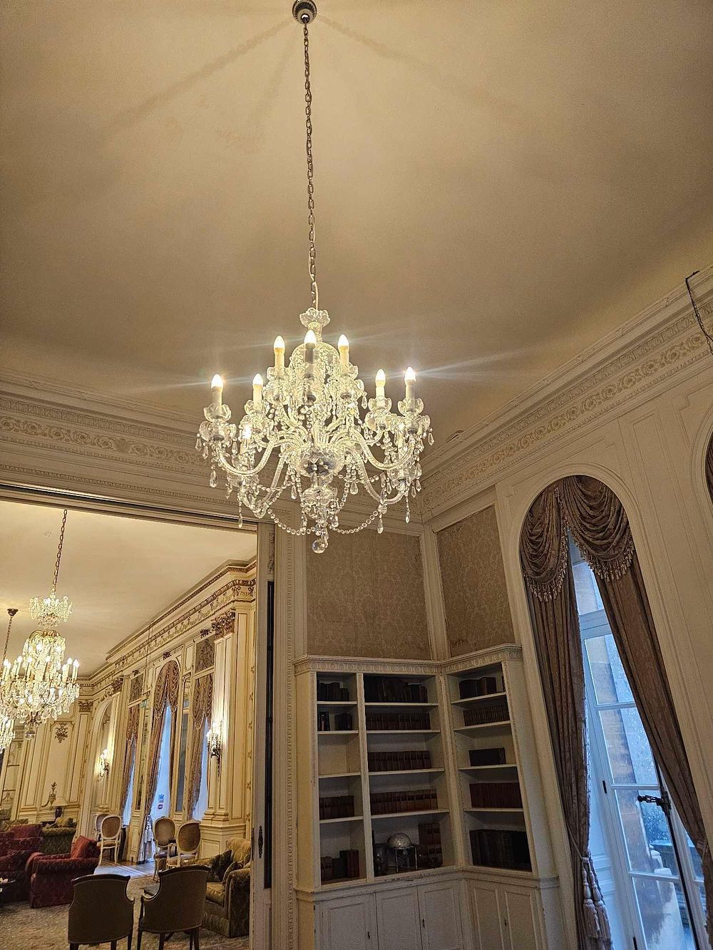Lot 189: A Contemporary Classical Revival Style Multi-Arm Crystal Chandelier