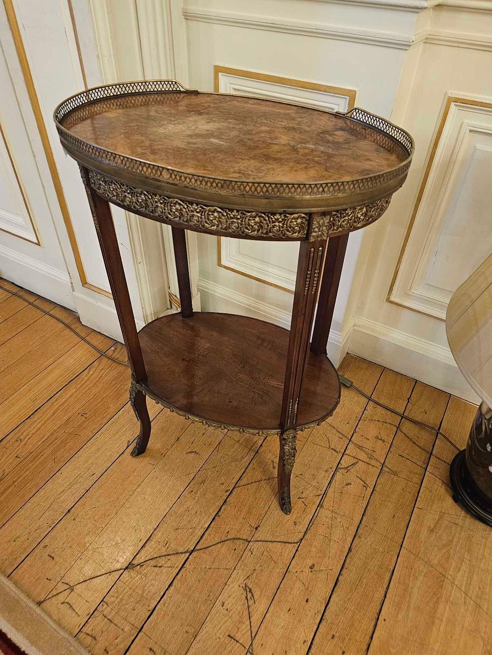 Lot 194: A French Louis XVI Style Burr Wood Veneer Two-Tiered Occasional Table, Late 19th/Early 20th Century