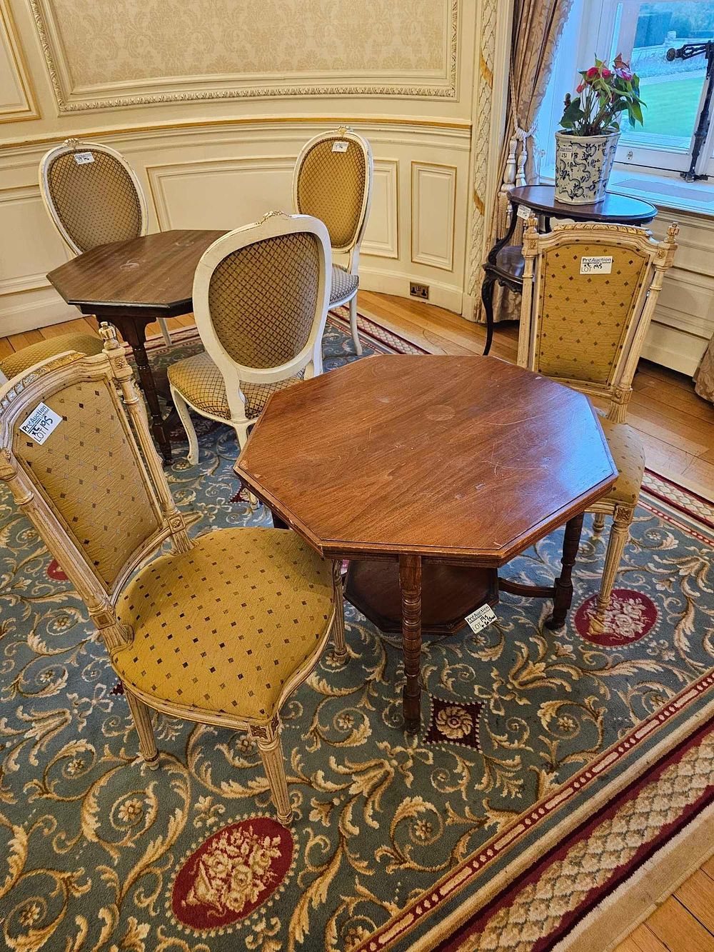 Lot 195: A Collection of Edwardian Style Walnut Octagonal Tables and a Group of Upholstered Chairs
