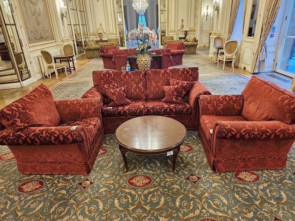 Lot 204: A Traditional Red Damask Three-Piece Seating Suite and Coffee Table