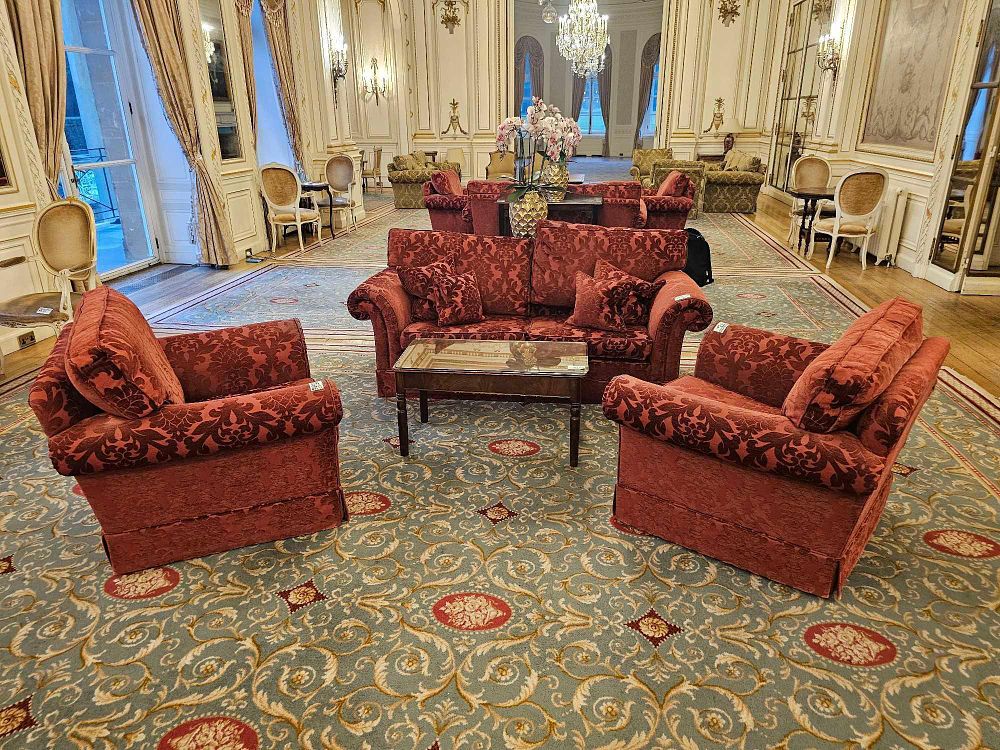 Lot 209: A Suite of Red Damask Upholstered Seating and a Glass-Top Coffee Table