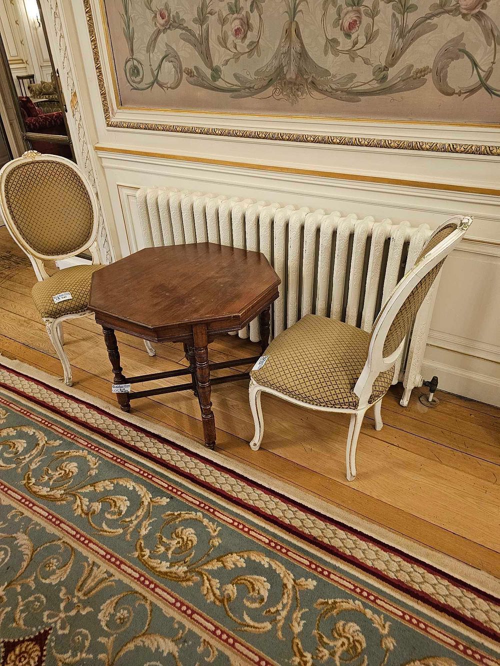 Lot 210: A Pair of French Neoclassical Style Painted and Gilt Wood Side Chairs and an Edwardian Octagonal Occasional Table