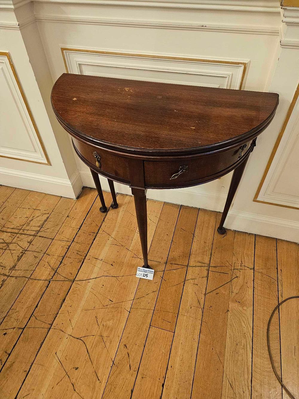 Lot 215: A Georgian Mahogany Demi-Lune Fold-Over Card Table