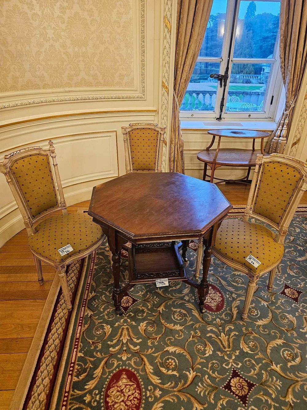 Lot 216: A Set of Four Louis XVI Revival Side Chairs and an Octagonal Wood Table