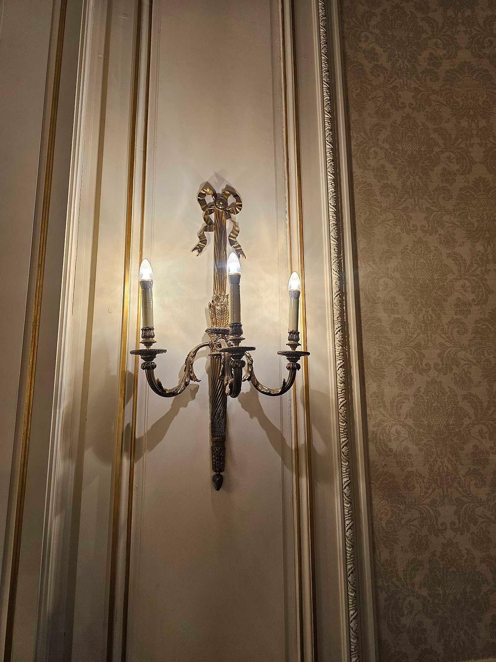 Lot 223: A French Louis XVI Style Patinated Bronze Three-Light Wall Sconce with Ribbon Bow