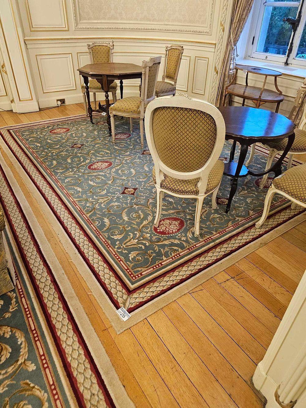 Lot 233: A Large Traditional Style Machine-Made Area Rug