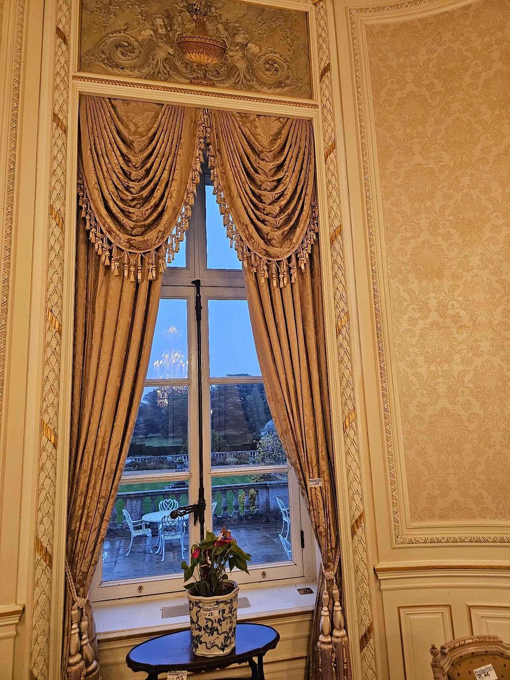 Lot 237: A Late 19th/Early 20th Century Neoclassical Revival Window Ensemble with Gold-Toned Brocade Draperies and a Chinese-Style Porcelain Pot