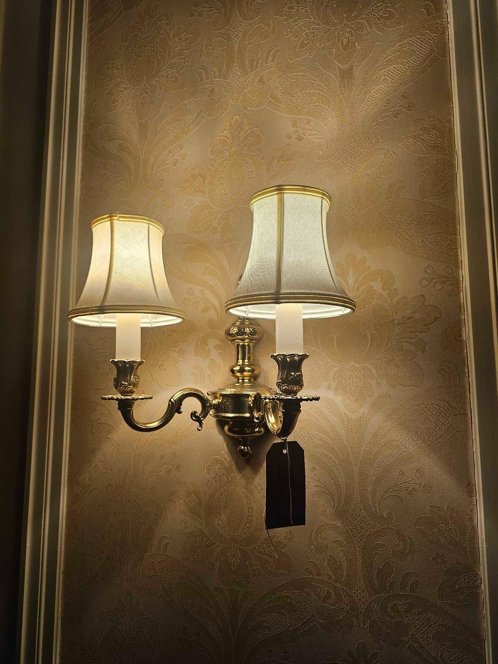 Lot 261: A Polished Brass Two-Light Wall Sconce in the Classical Revival Style