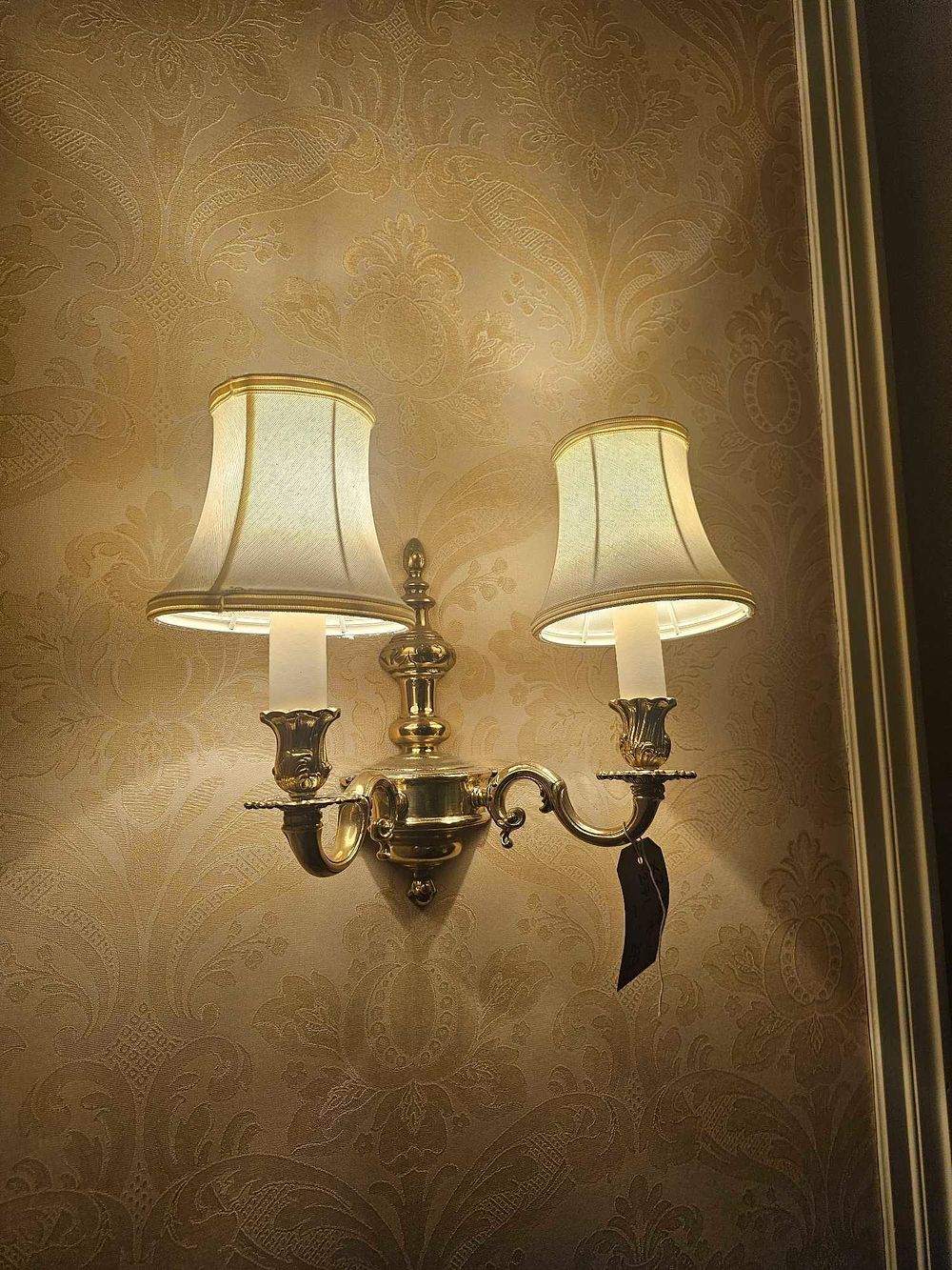 Lot 274: A Traditional Ornate Double-Arm Wall Sconce in Polished Brass-Tone Metal