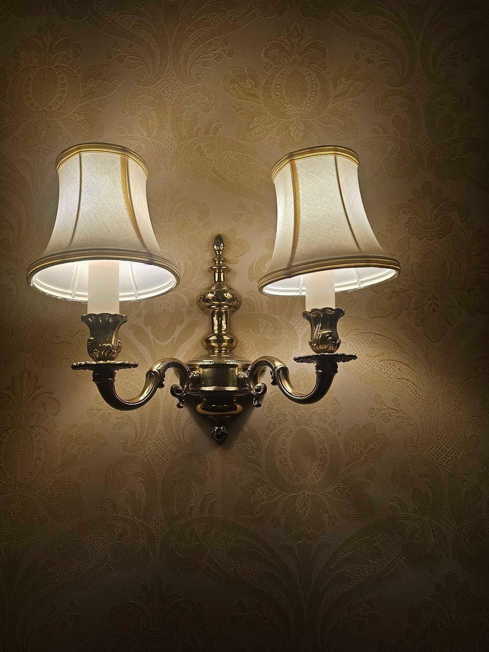 Lot 283: A Two-Light Traditional Brass-Tone Wall Sconce