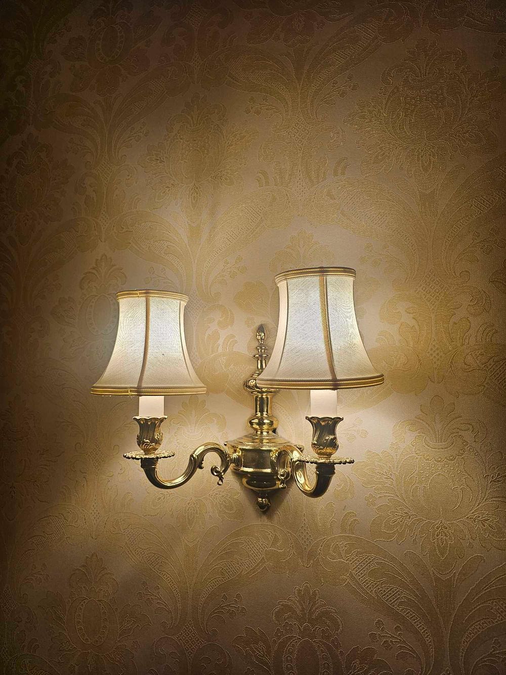 Lot 310: A Colonial Revival Brass Two-Light Wall Sconce