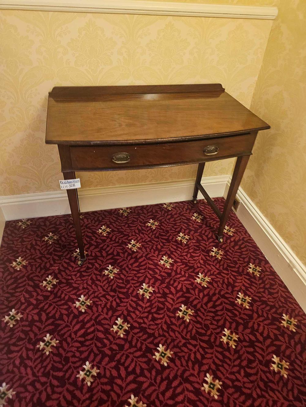 Lot 328: A 19th Century Georgian Style Bow-Fronted Mahogany Side Table