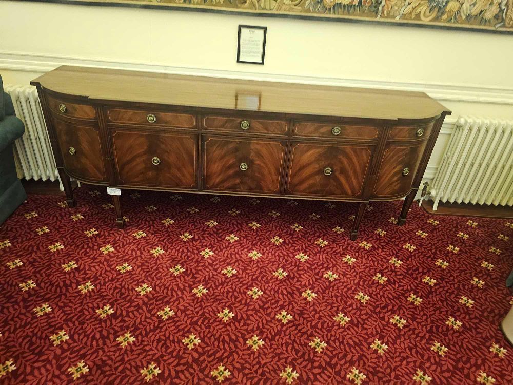 Lot 337: A Hepplewhite Style Inlaid Mahogany Serpentine-Front Sideboard