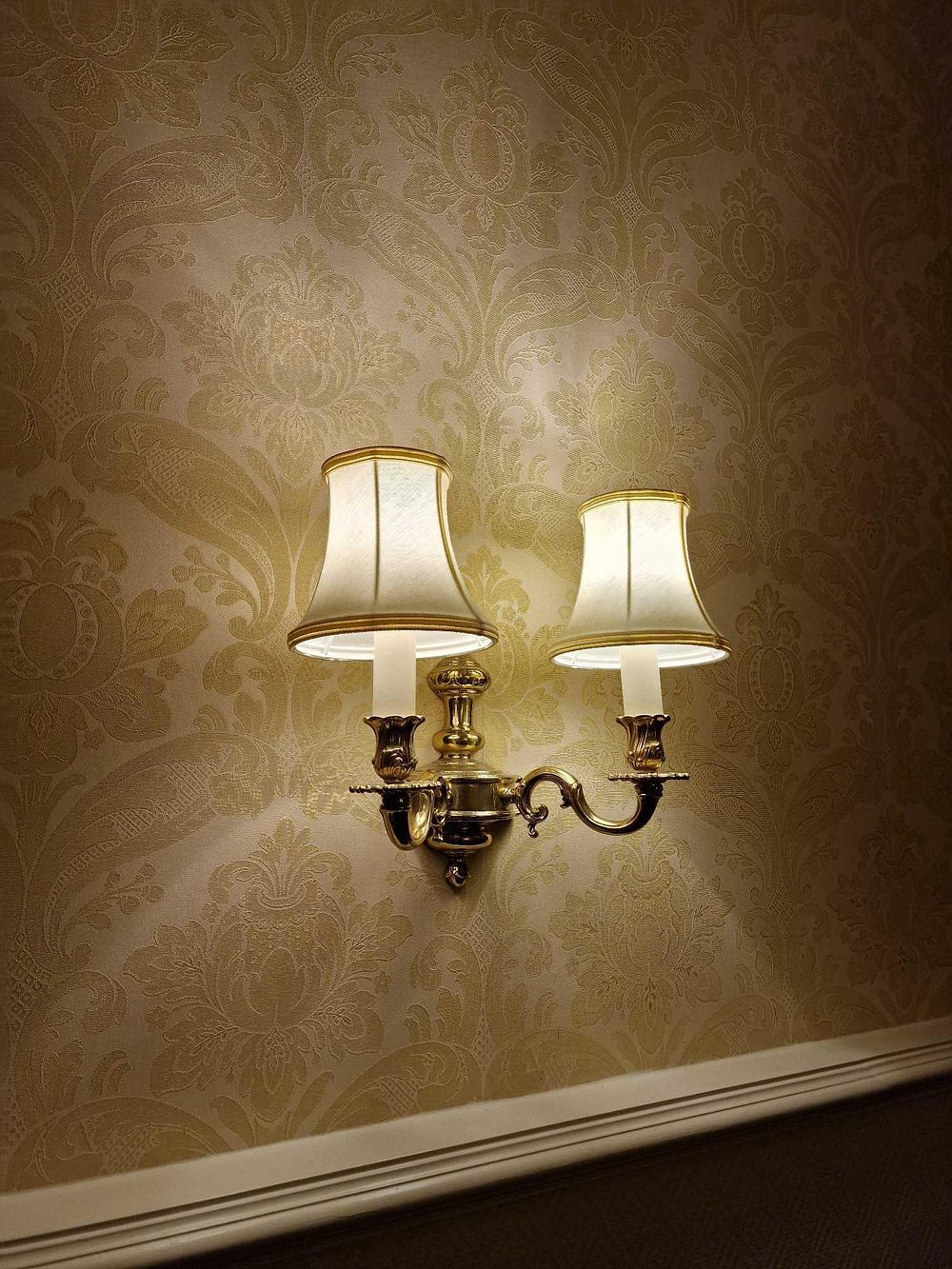 Lot 368: A Classical Revival Style Double-Arm Brass Wall Sconce