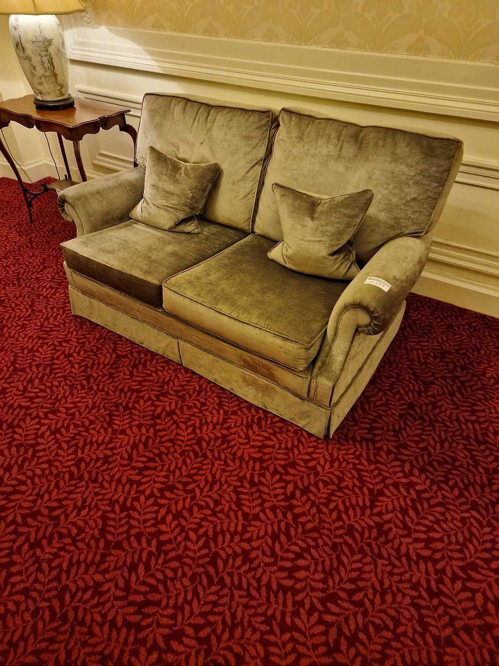 Lot 377: A Vintage Green Velvet Upholstered Two-Seater Sofa