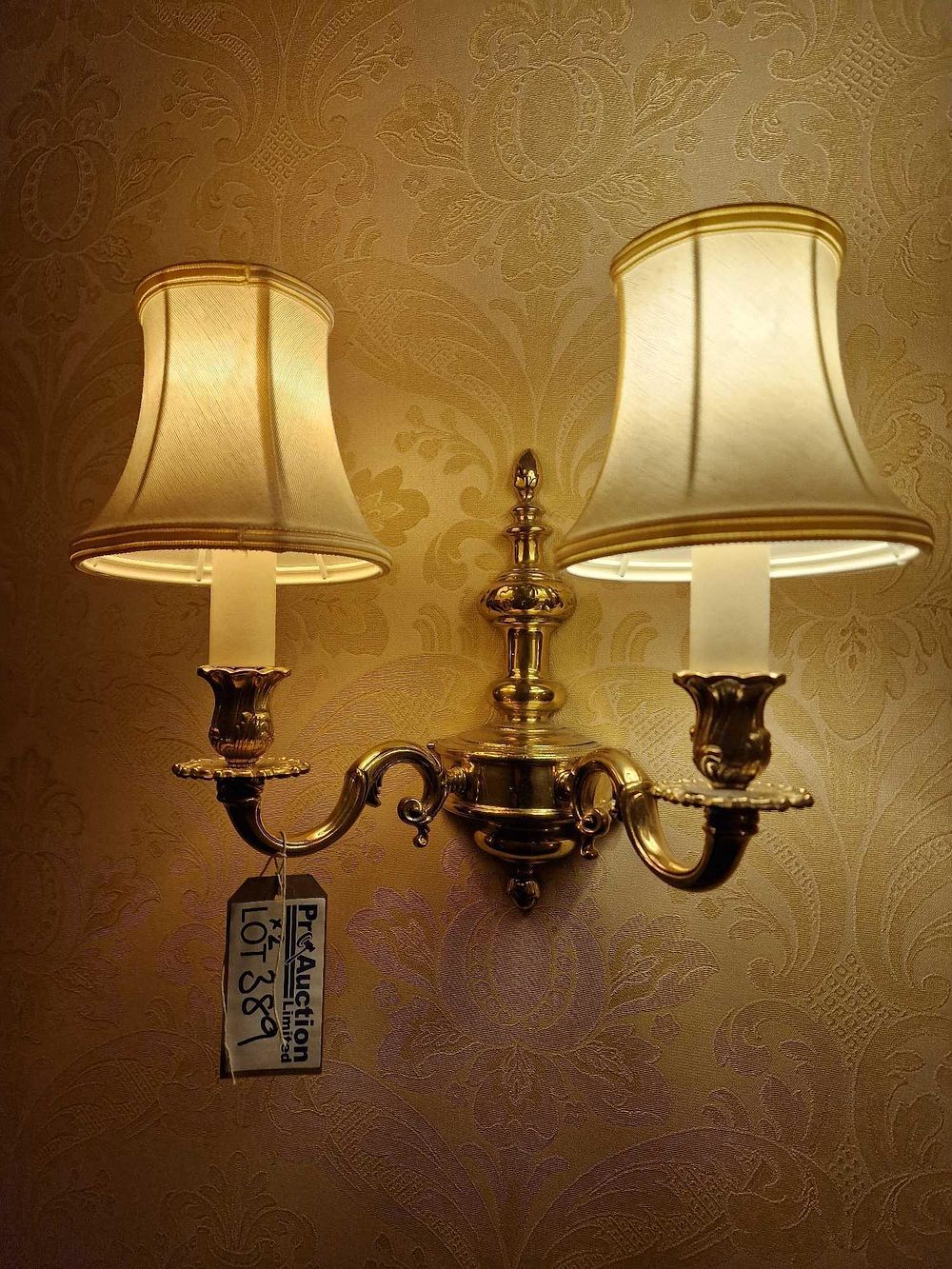 Lot 389: A 20th Century European Style Two-Light Brass Wall Sconce with Fabric Shades