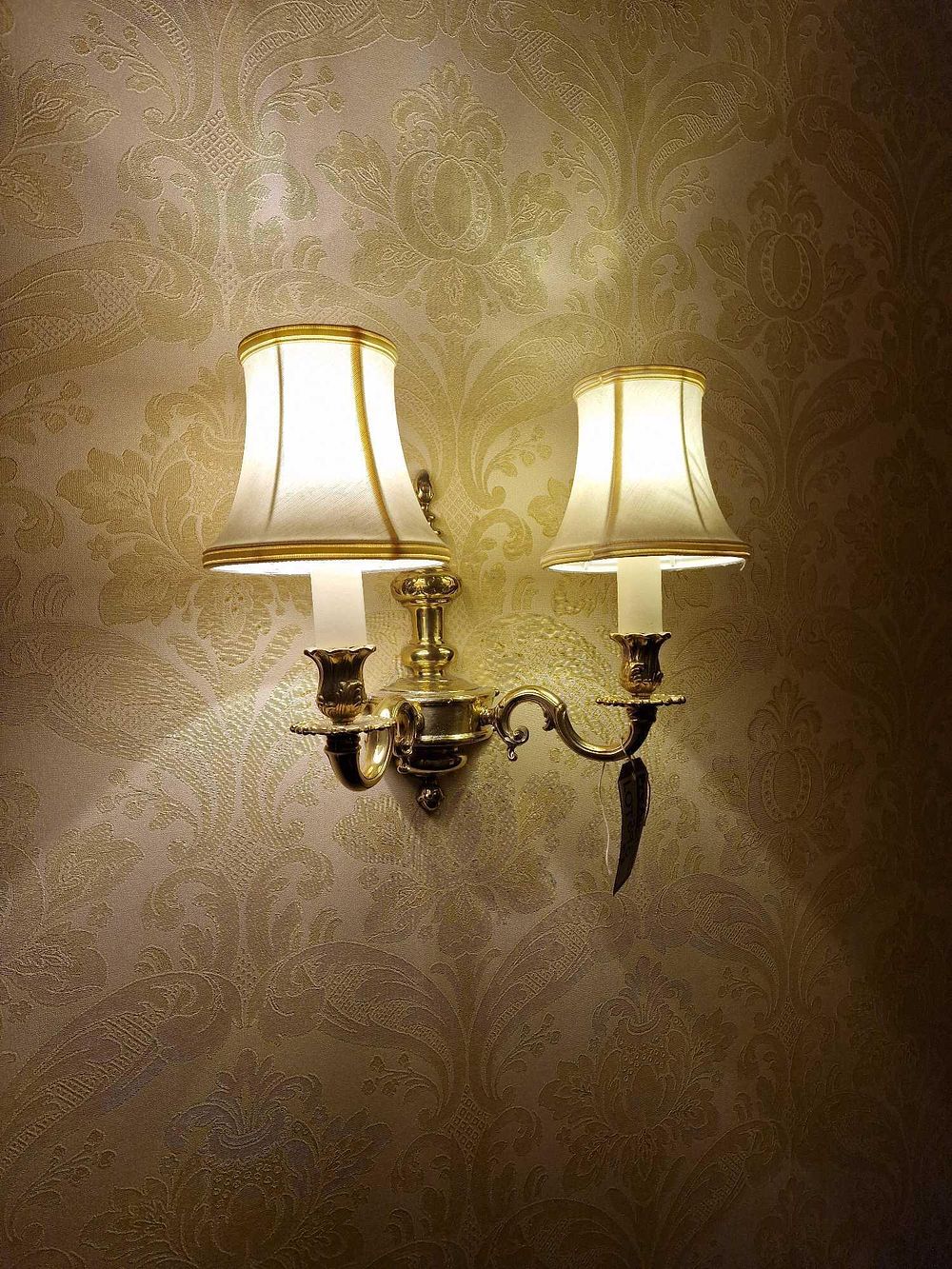 Lot 390: A Double-Arm Brass Wall Sconce, Rococo/Neoclassical Revival Style, from a Hotel
