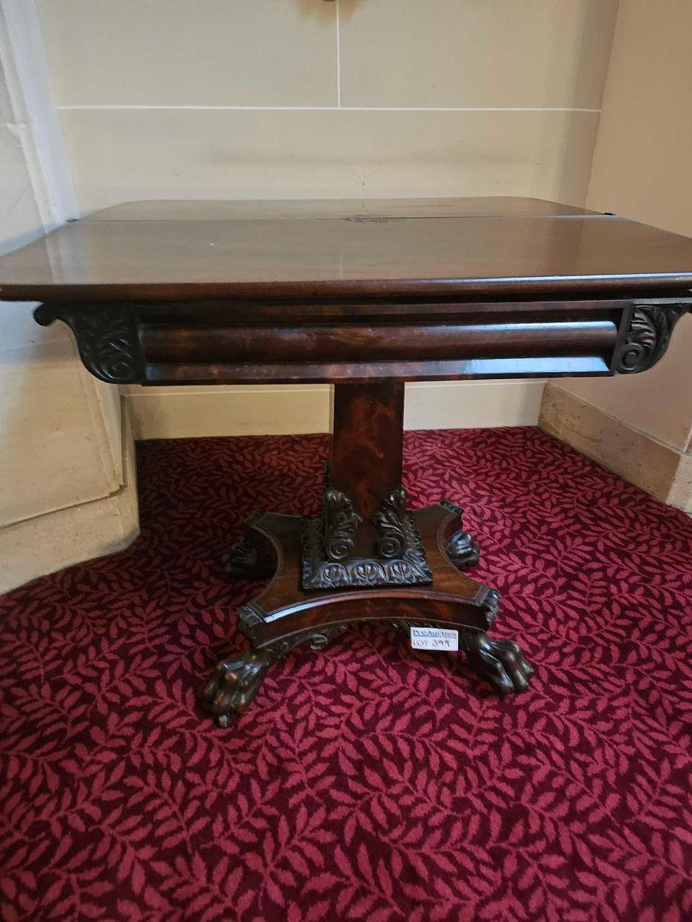 Lot 399: An American Empire Mahogany Flip-Top Card Table with Paw Feet, circa 1820-1840