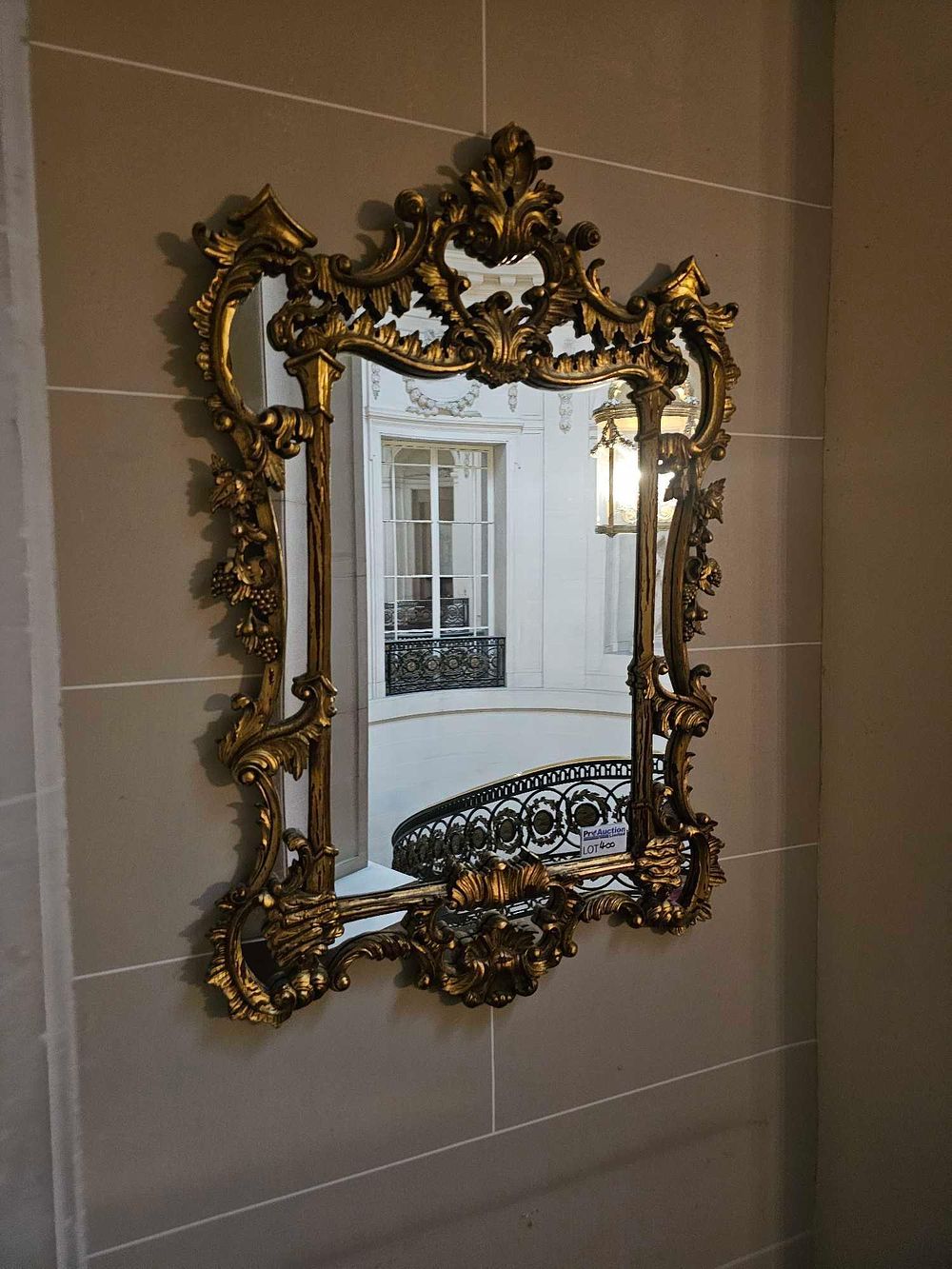 Lot 400: A Mid-20th Century French Rococo Style Carved Giltwood Wall Mirror